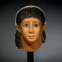 A Fine Egyptian Gypsum Mask of a Young Woman