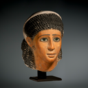 A Fine Egyptian Gypsum Mask of a Young Woman
